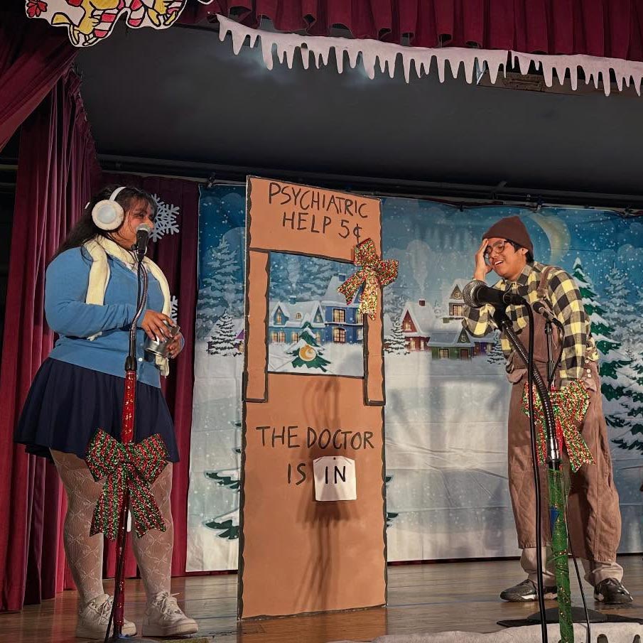 two children act onstage in winter Peanuts play